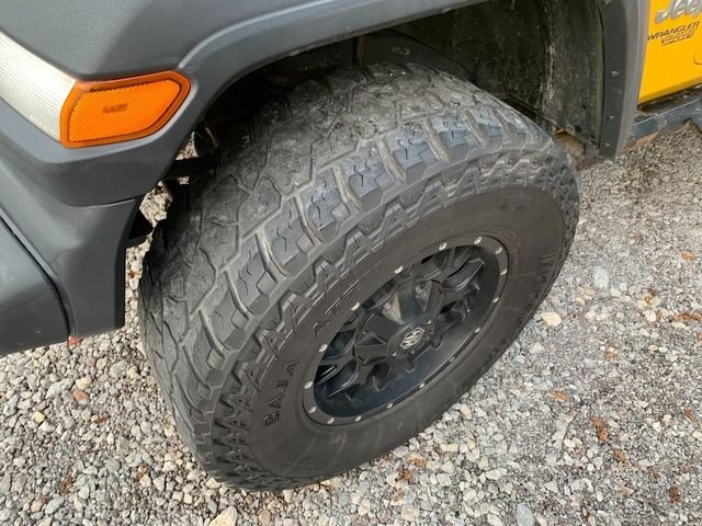 Used 2018 Yellow Jeep Unlimited Sport image 2