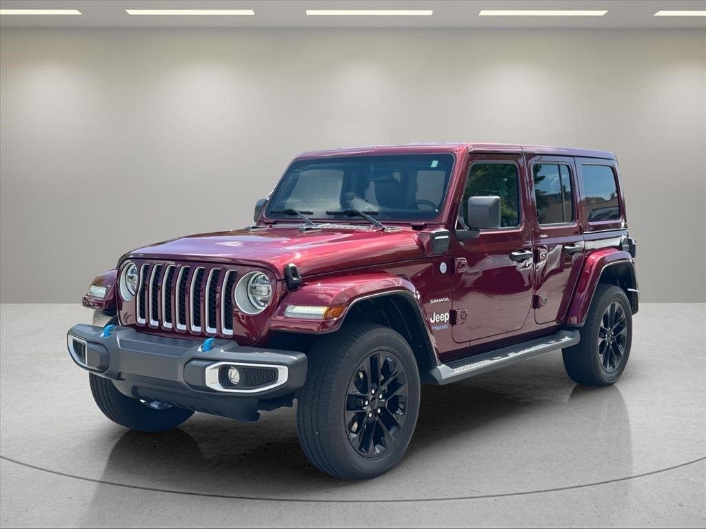 Used 2022 Snazzberry Pearlcoat Jeep Unlimited Sahara image 1