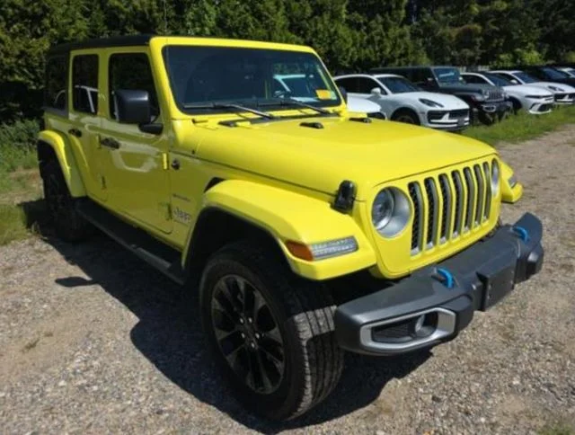 Used 2023 Yellow Jeep Sahara 4xe image 1
