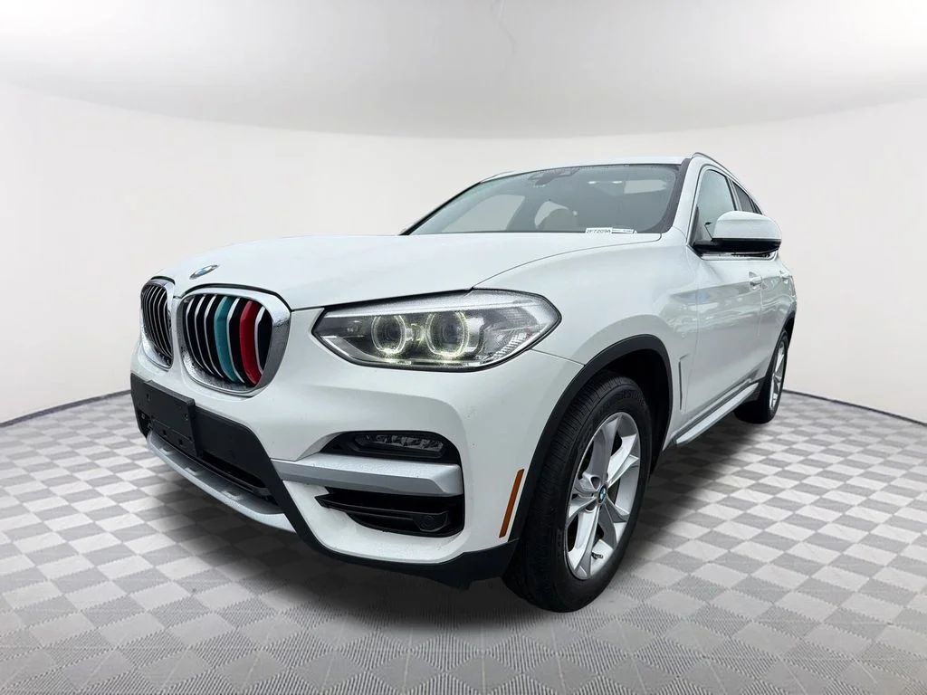 Used 2021 White BMW sDrive30i image 1