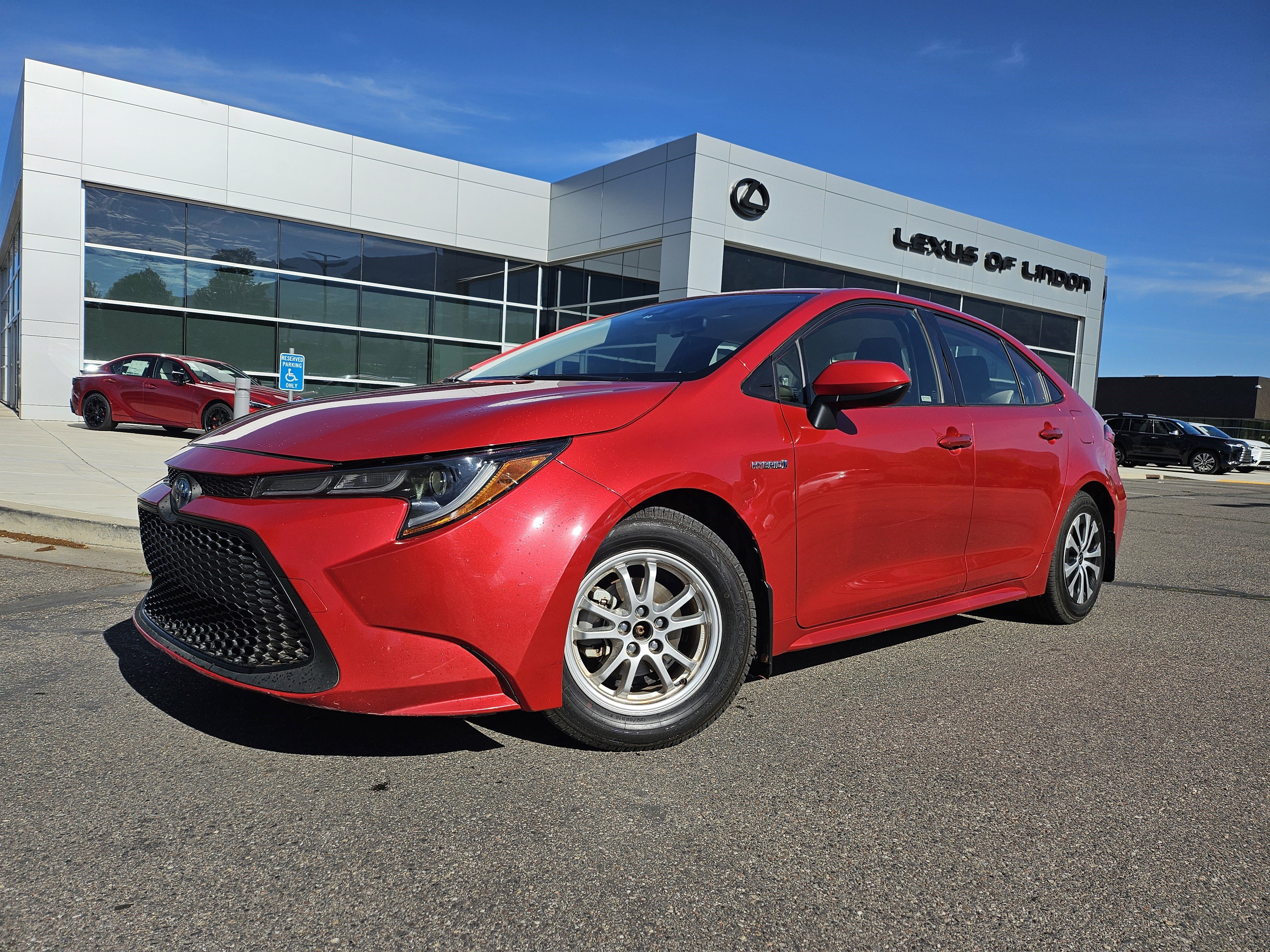 Used 2021 Barcelona Red Metallic Toyota LE image 1