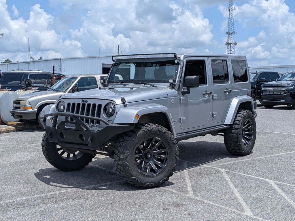 Used 2017 Silver Jeep Unlimited Sahara image 1