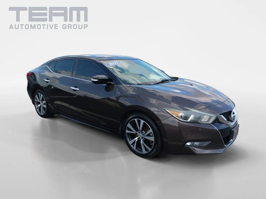 Used 2017 Brown Nissan Platinum image 1