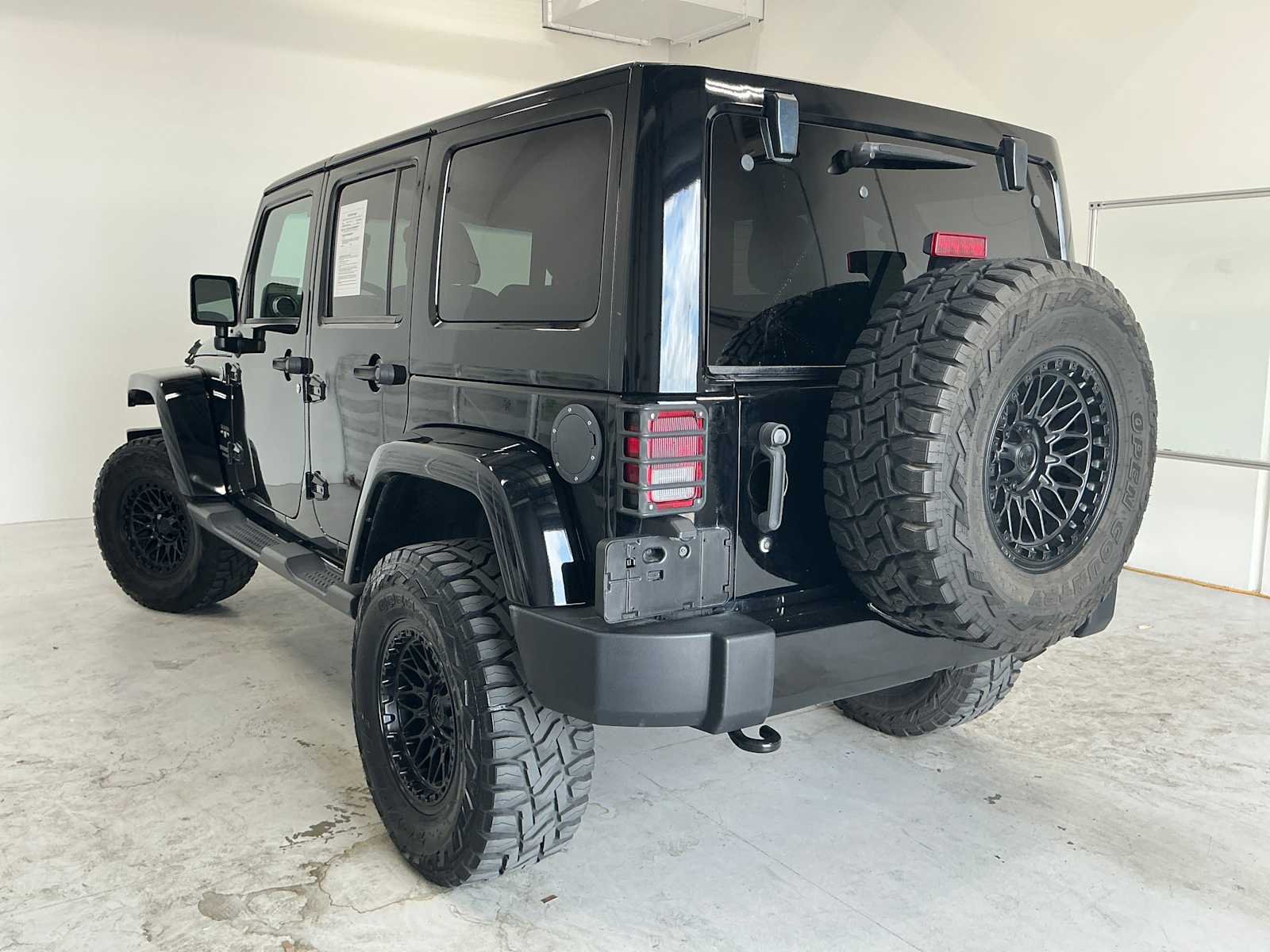 Used 2016 Black Clearcoat Jeep Sahara image 6