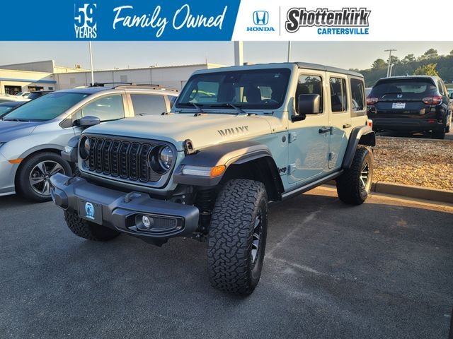 Used 2024 Gray Jeep Sport image 1