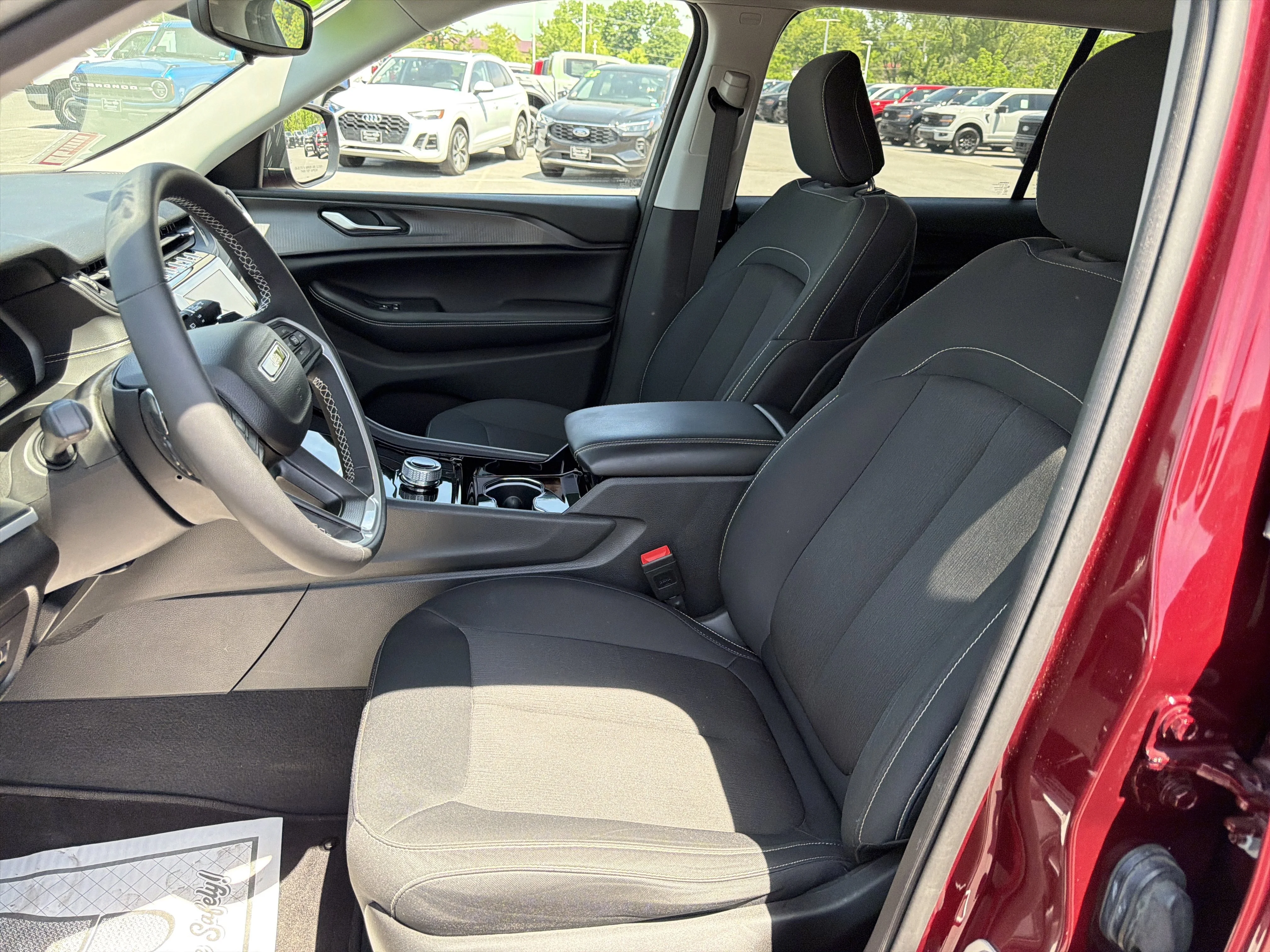 Used 2023 Velvet Red Pearlcoat Jeep Laredo image 12