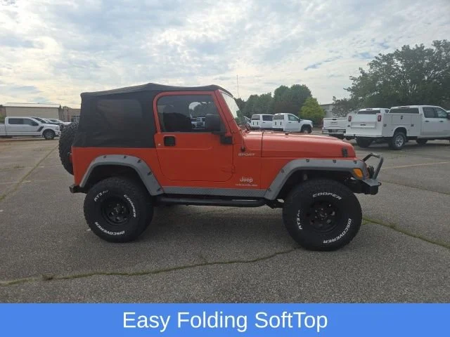 Used 2005 Impact Orange Cle Jeep Sport image 14