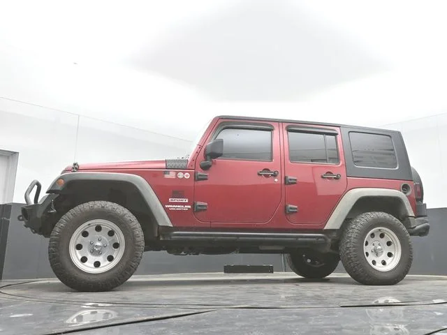 Used 2012 Red Jeep Unlimited Sport image 28
