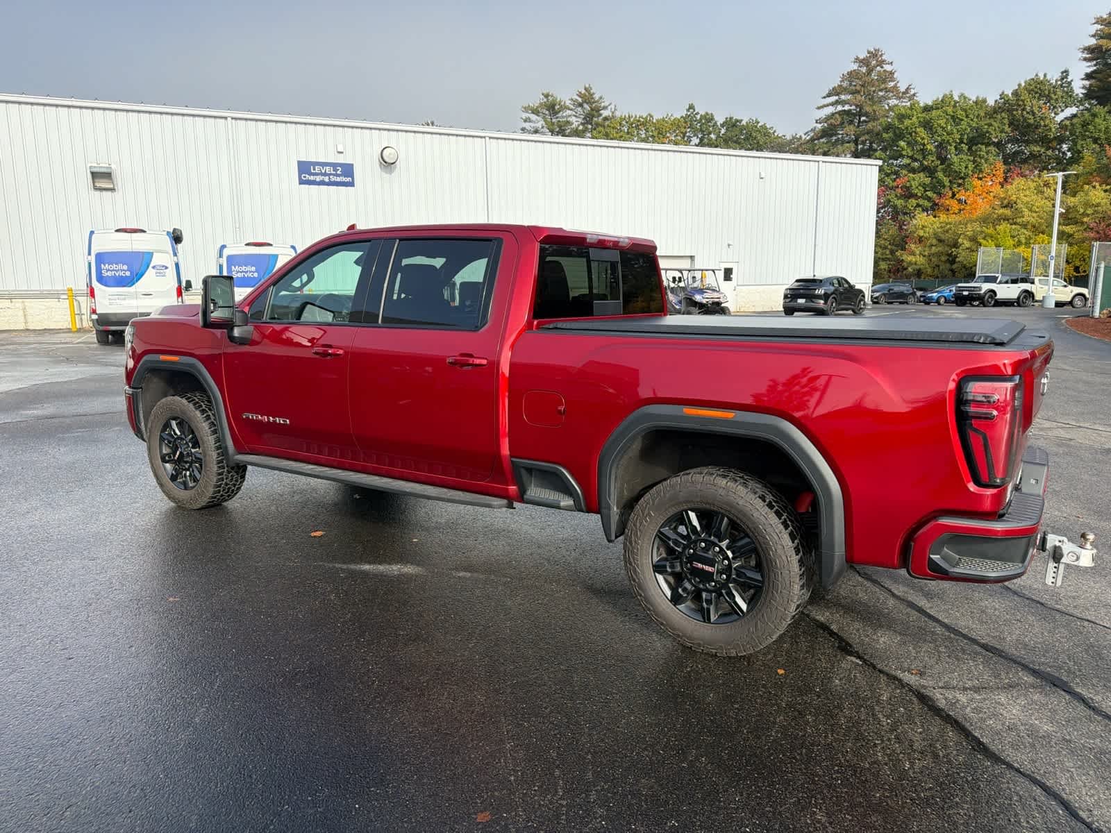 Used 2025 Volcanic Red Tintcoat GMC AT4 image 9