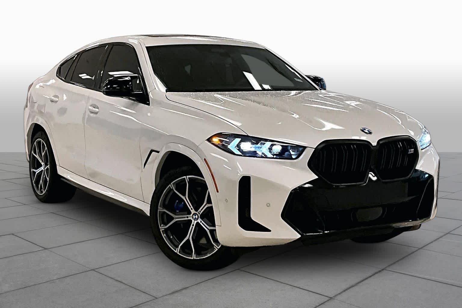 Used 2024 Mineral White Metallic BMW M60i image 2