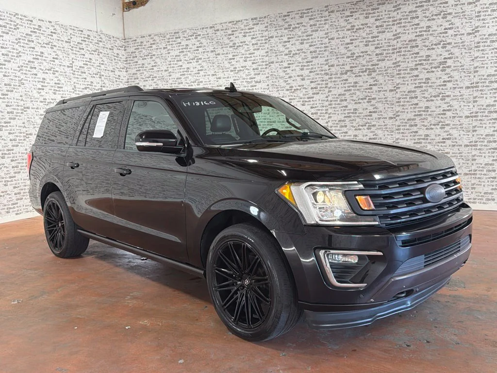 Used 2021 Agate Black Metallic Ford Limited image 1