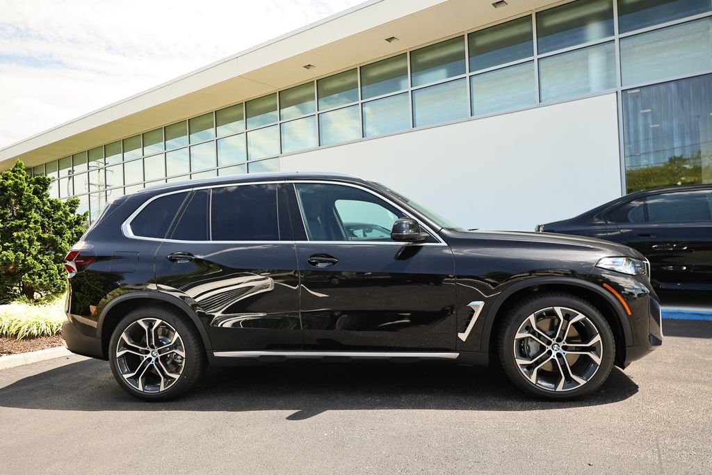 New 2026 Black Sapphire Metallic BMW xDrive50e image 4