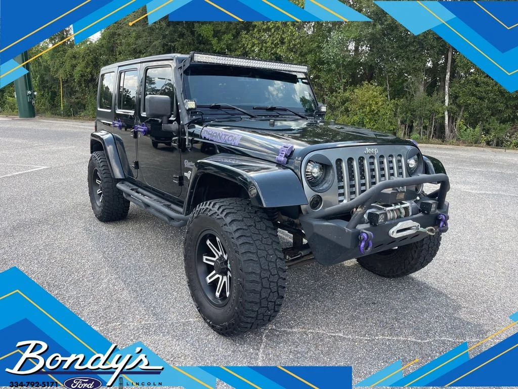 Used 2013 Black Clearcoat Jeep Unlimited Sport image 1