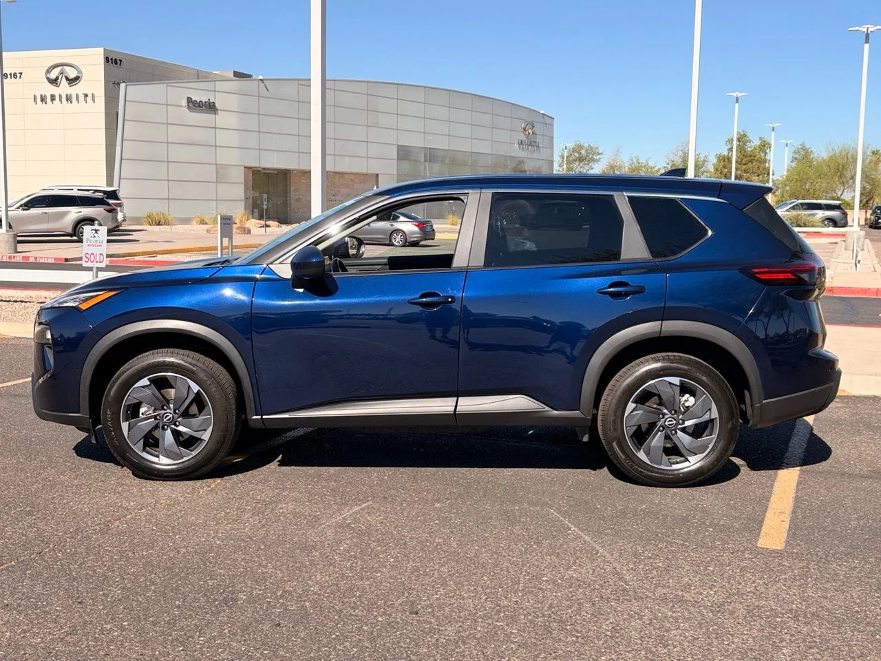 Used 2025 Deep Ocean Blue Pearl Nissan SV image 2