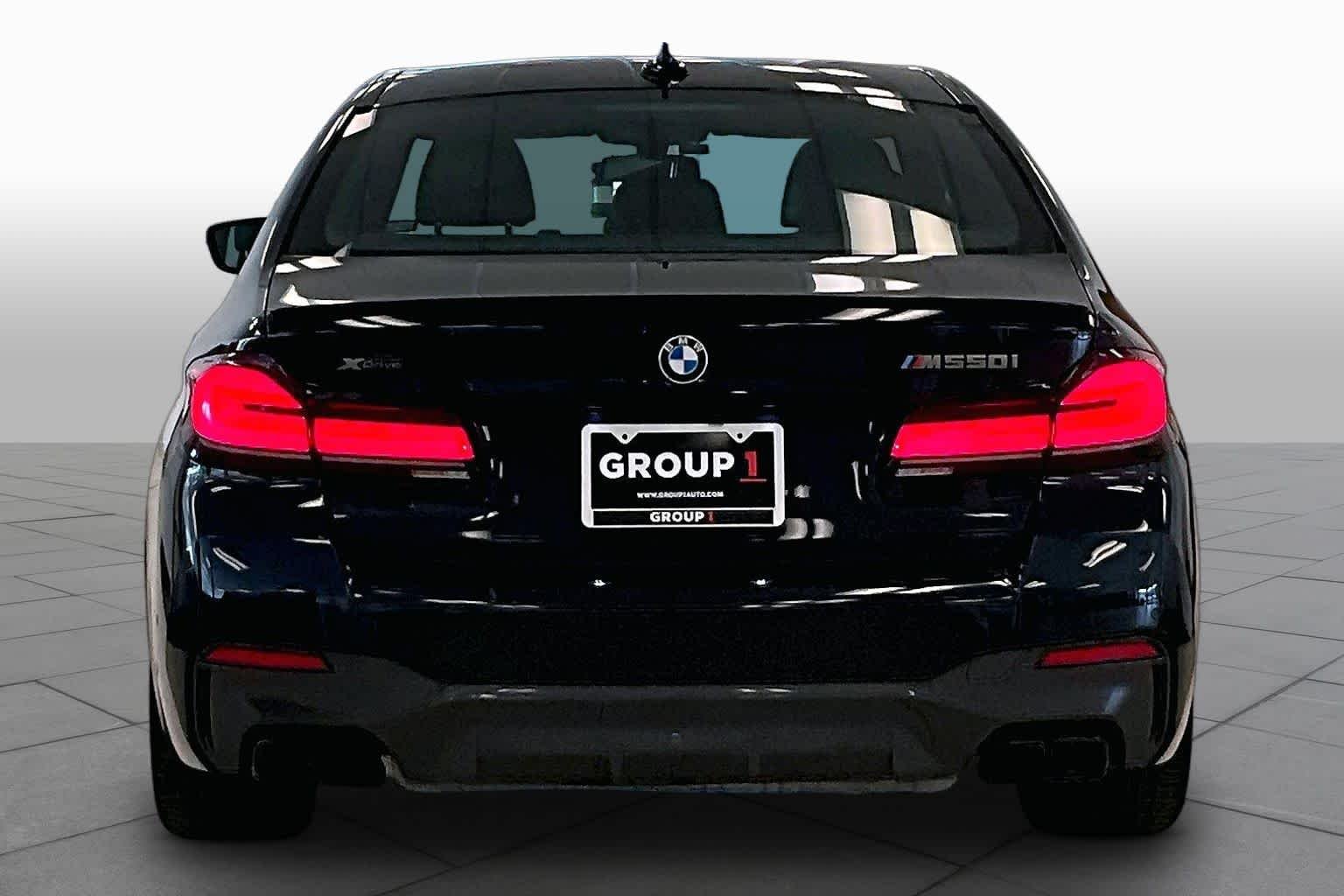 Used 2023 Carbon Black Metallic BMW M550i xDrive image 4