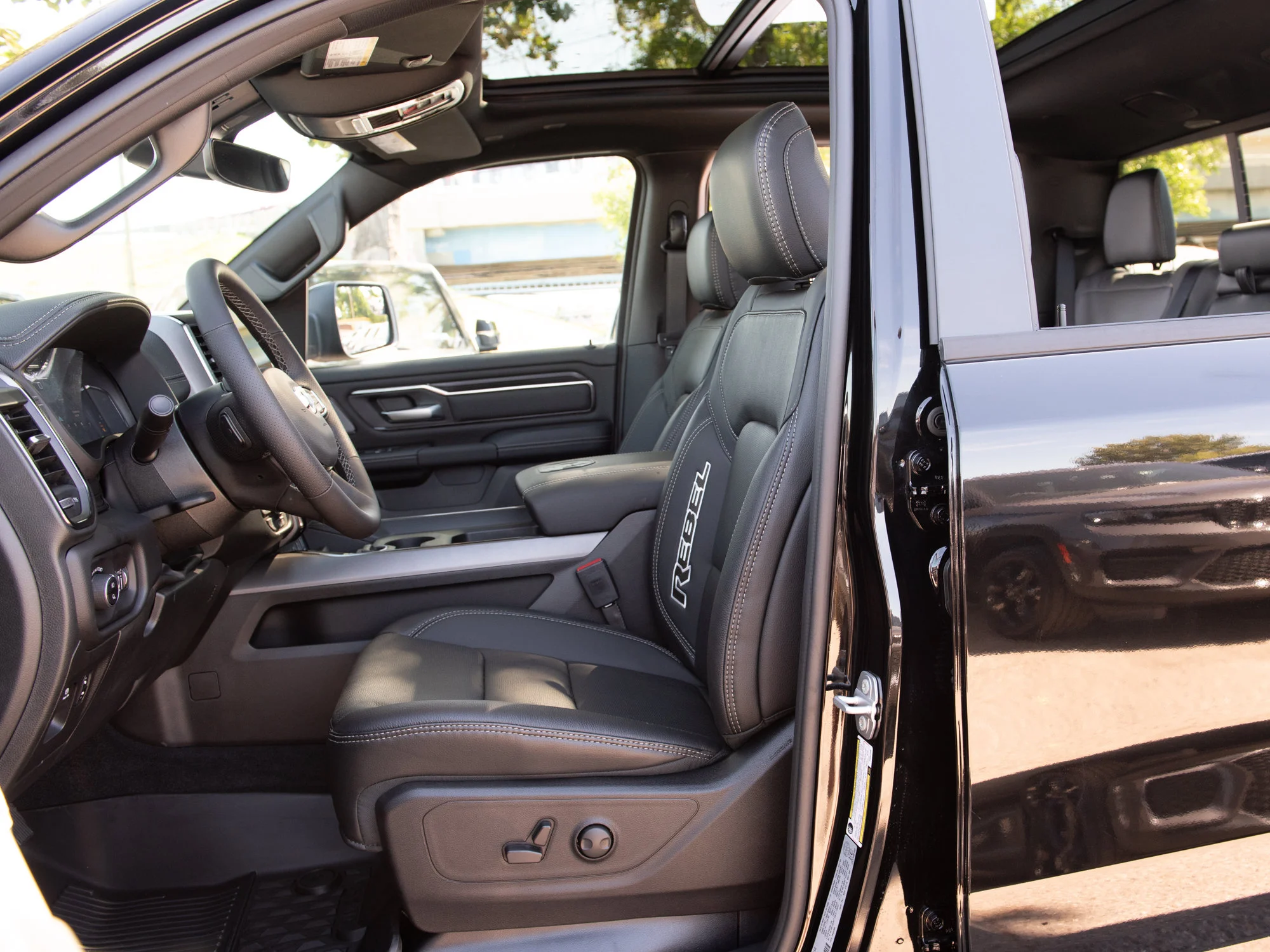 New 2026 Black RAM Rebel* Crew Cab 4x4, 33 Inch A/T Tires, Pano Sunroof, Passenger Screen image 24