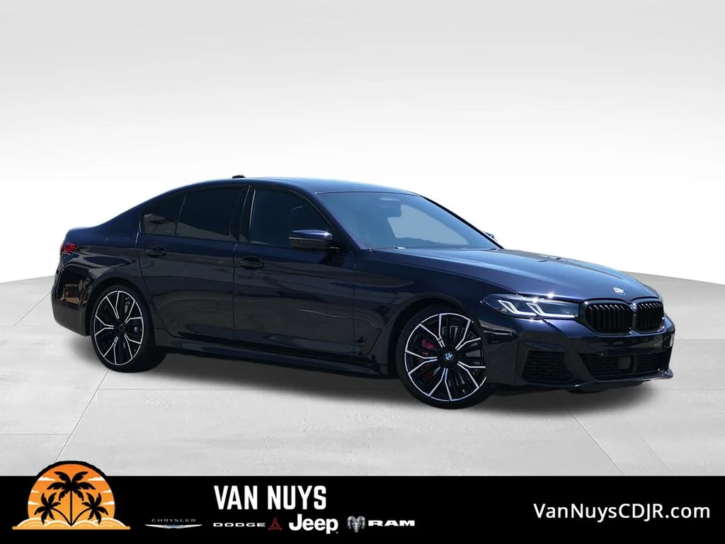 Used 2023 Carbon Black Metallic BMW M550i xDrive image 1