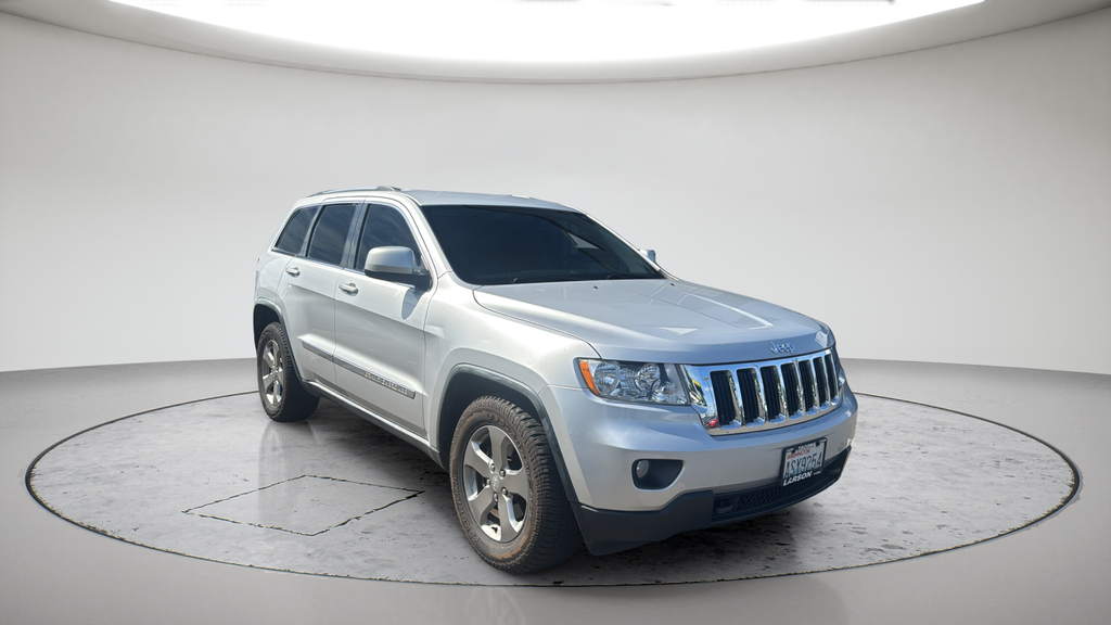 Used 2011 Silver Jeep Laredo image 1
