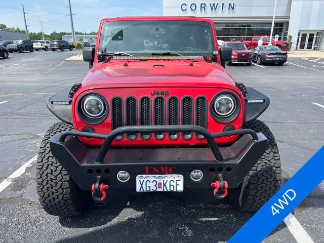 Used 2015 Firecracker Red Jeep Unlimited Sport image 2