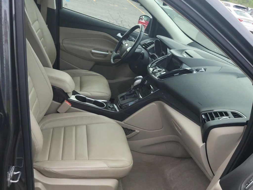 Used 2016 Ford Escape Titanium with VIN 1FMCU9JX4GUB86304 for sale in Marion, IA