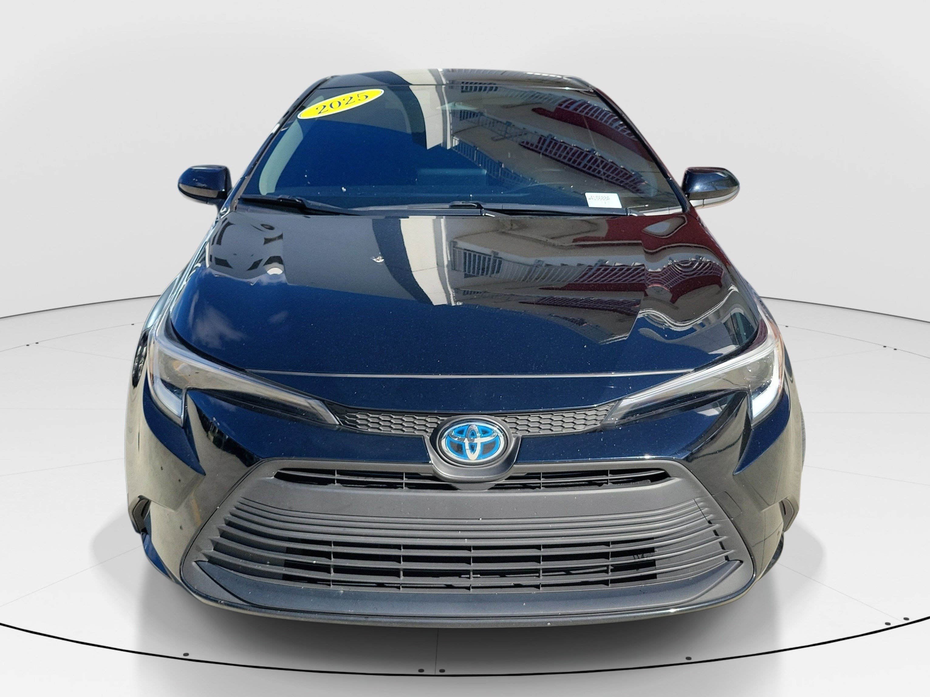 Used 2025 Midnight Black Metallic Toyota Hybrid LE image 2