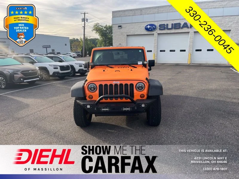Used 2013 Orange Jeep Unlimited Sport image 6