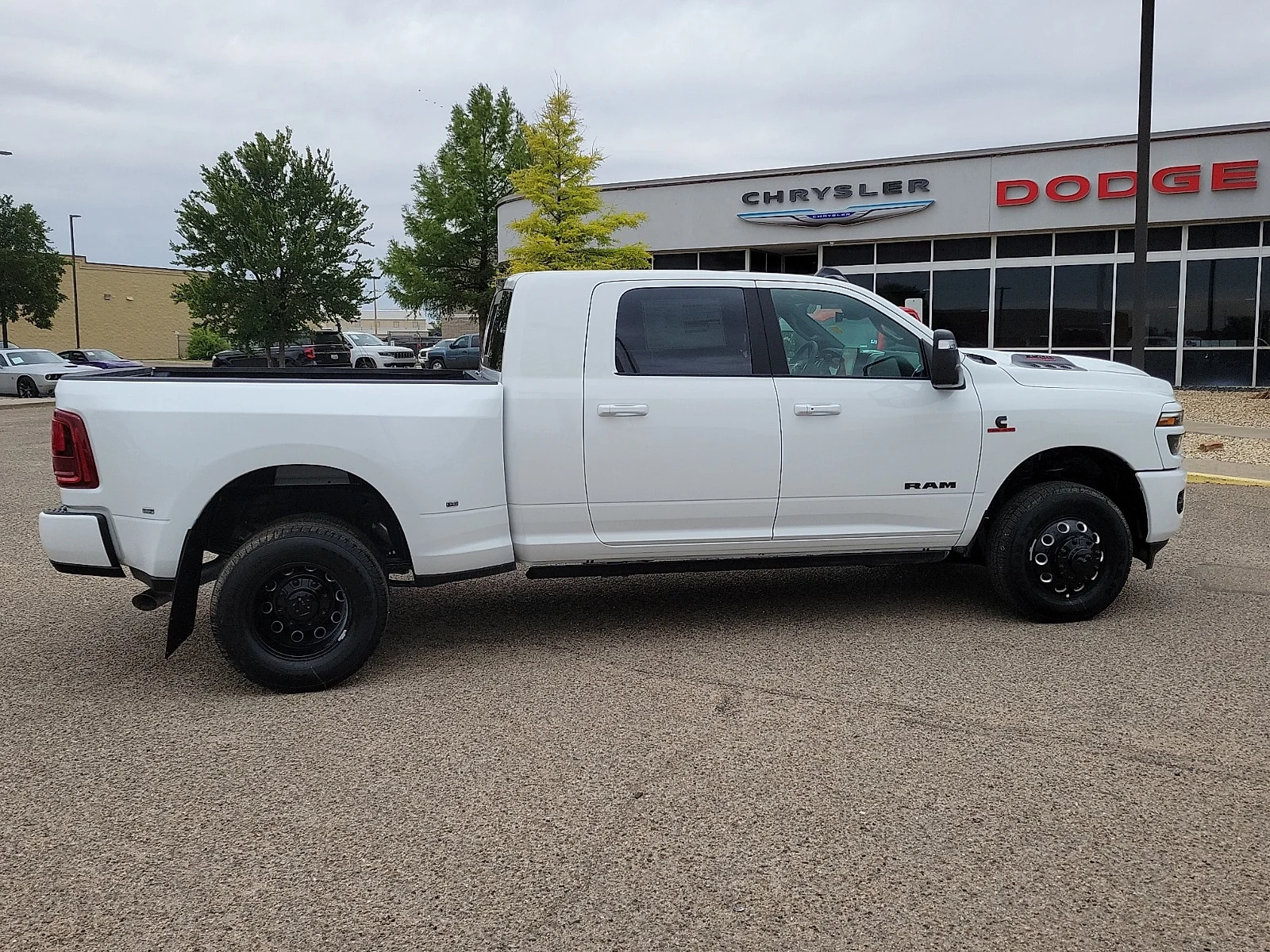 New 2026 PW7 Bright Whit Ram LARAMIE MEGA CAB 4X4 6