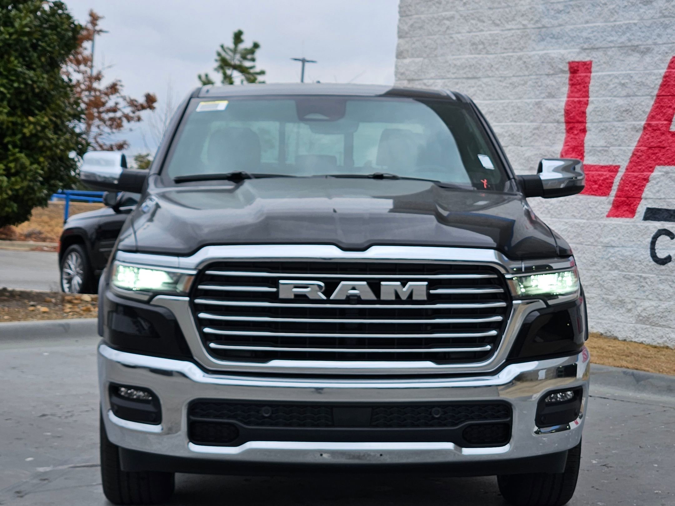 New 2026 Diamond Black Crystal Pearl-Coat Exterior Paint RAM Laramie image 2