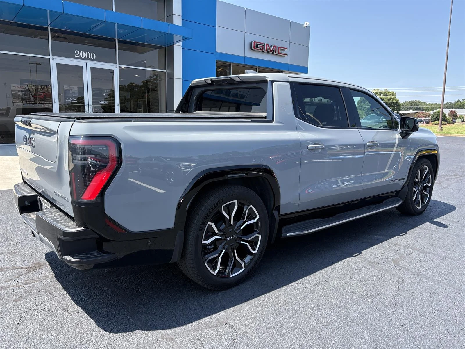 Used 2025 Thunderstorm Gray GMC Max Range Denali image 4