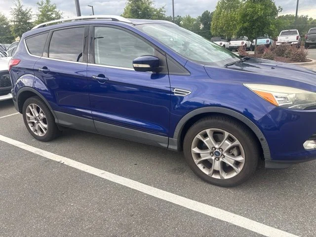 Used 2014 Blue Ford Titanium image 1