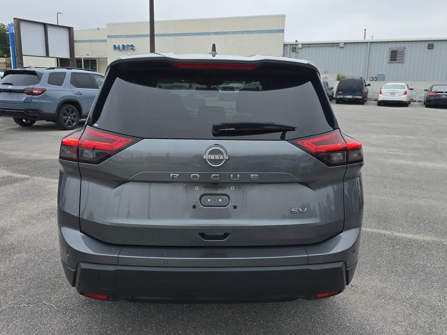 Used 2024 Gun Metallic Nissan SV image 4