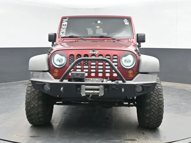 Used 2012 Red Jeep Unlimited Sport image 2