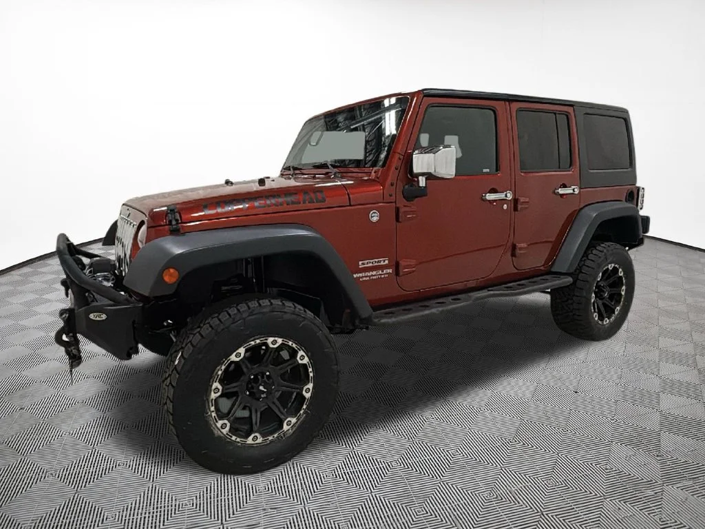 Used 2014 Orange Jeep Unlimited Sport image 2