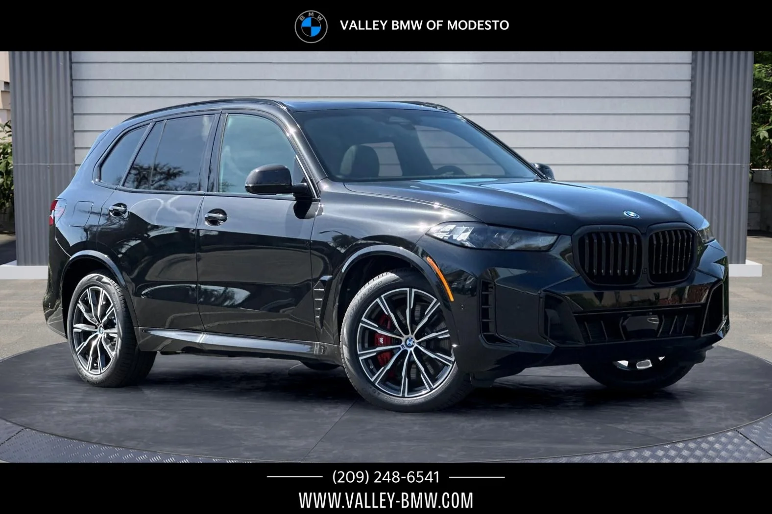 New 2026 Black Sapphire Metallic BMW xDrive50e image 1