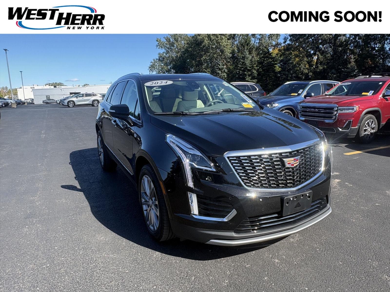 Used 2024 Stellar Black Metallic Cadillac AWD Premium Luxury image 1