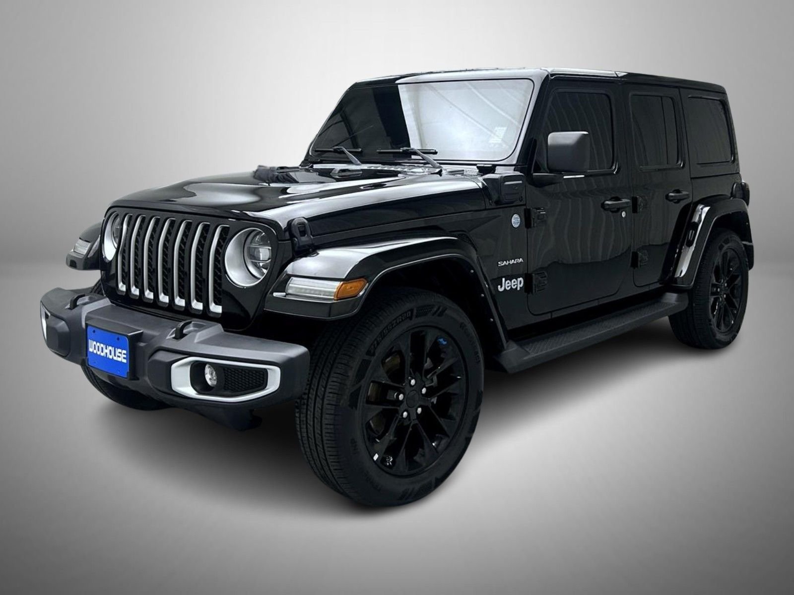 Used 2022 Black Jeep Unlimited Sahara 4xe image 1