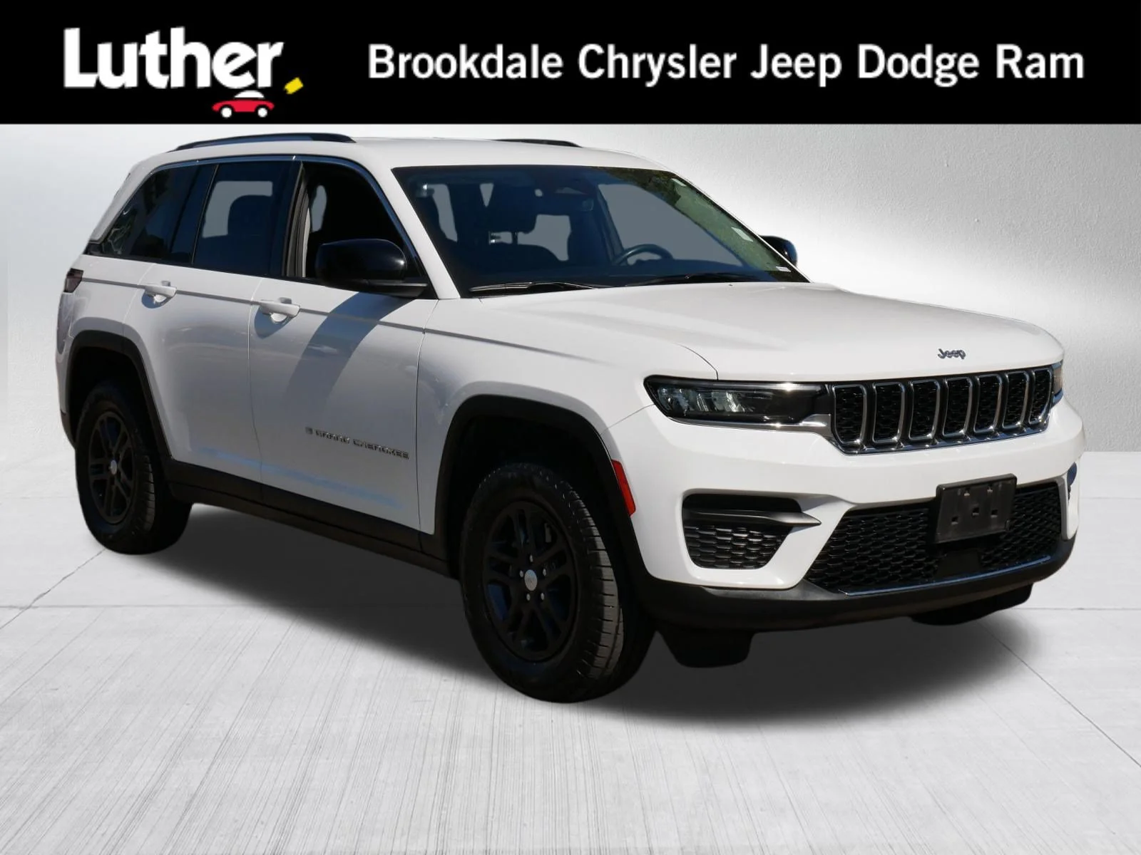 Used 2023 Bright White Clearcoat Jeep Laredo image 1