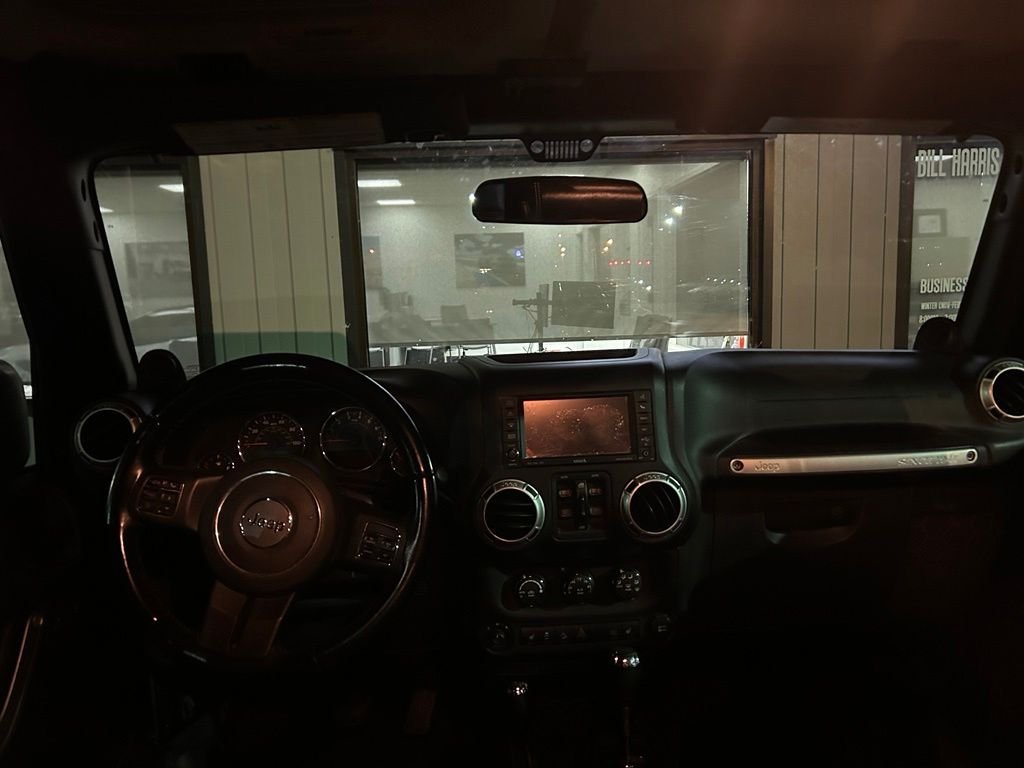 Used 2012 Black Jeep Unlimited Sahara image 5