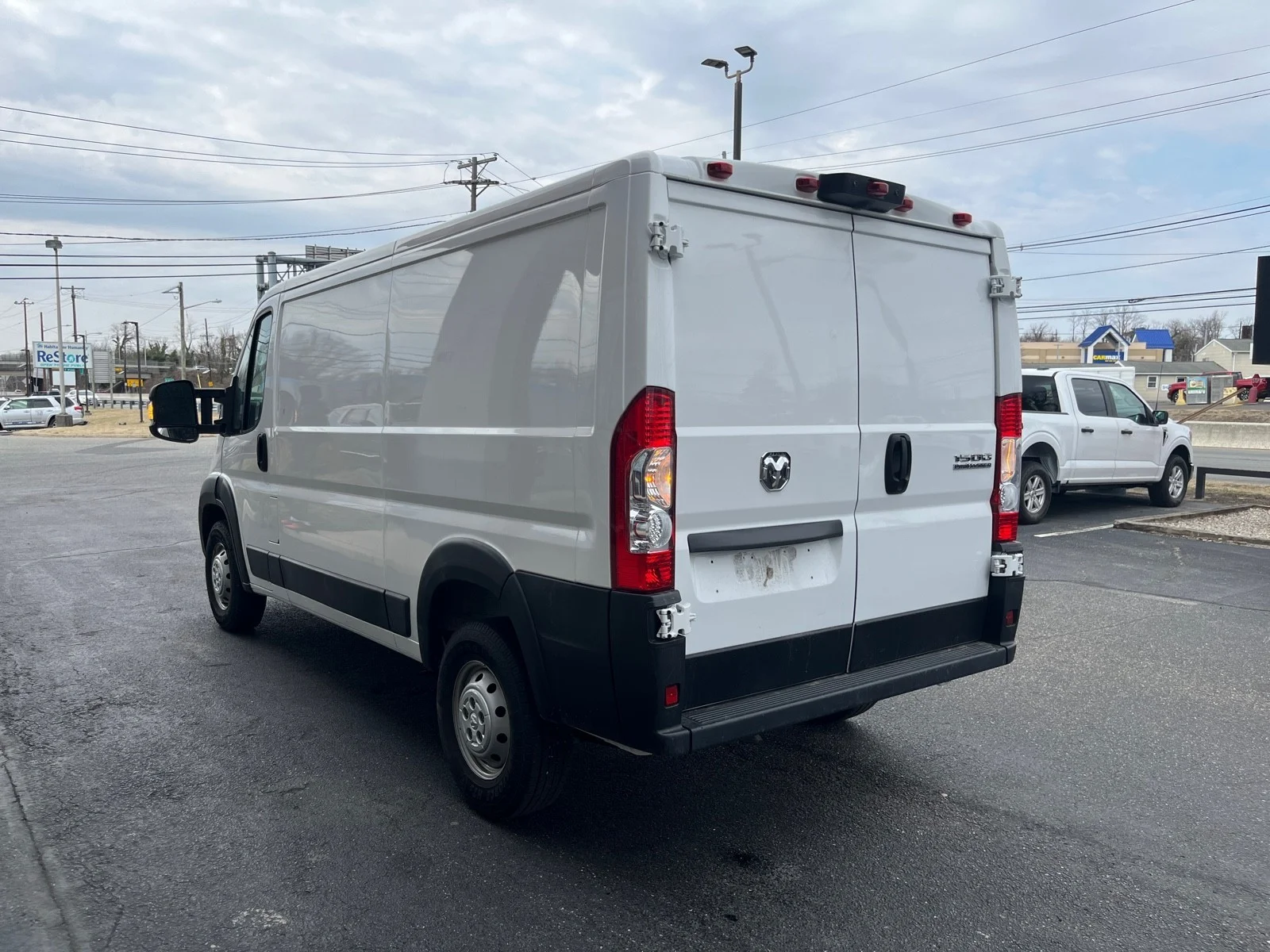 Used 2023 Bright White Clearcoat Ram Low Roof WB image 4