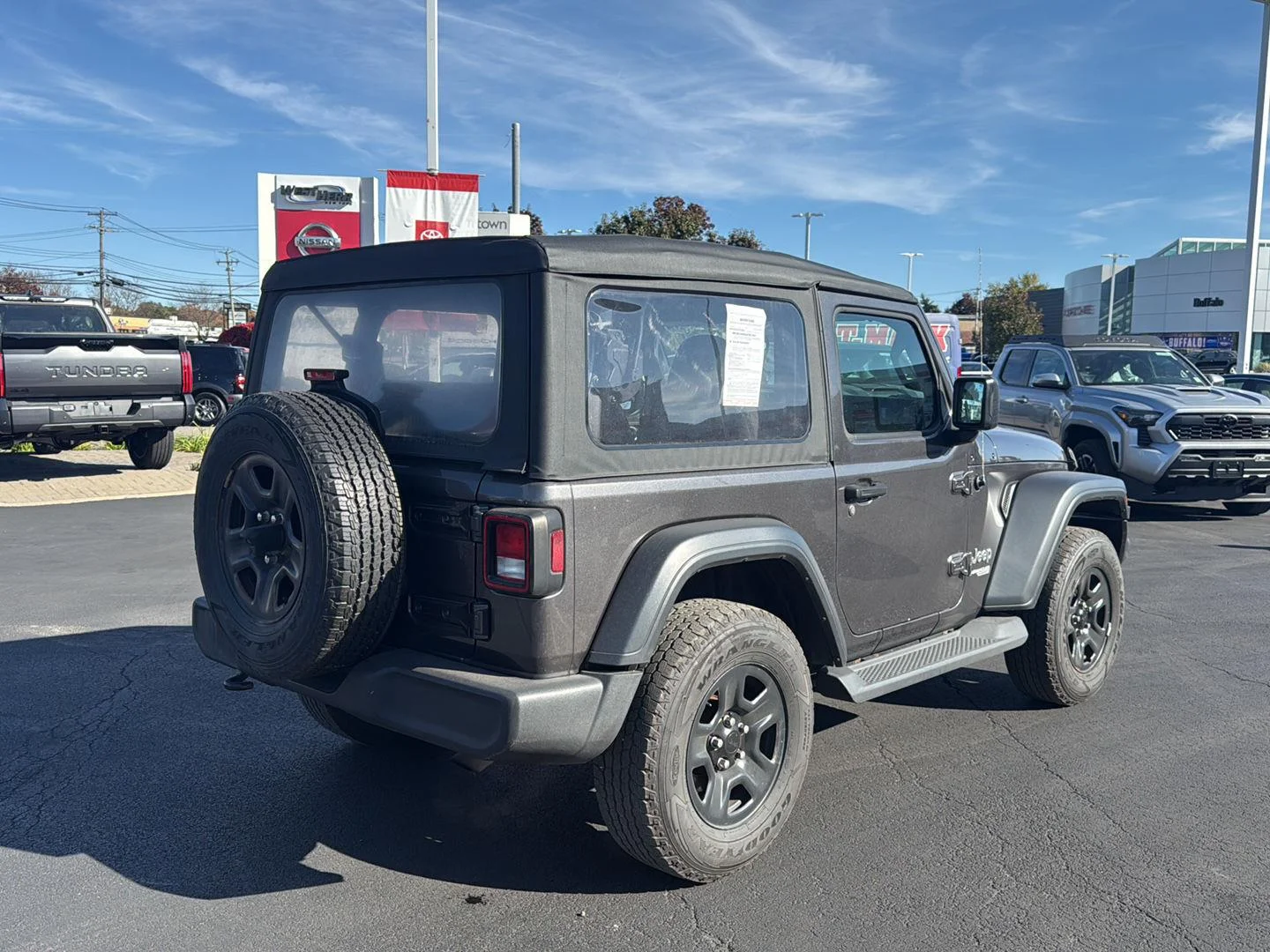 Used 2018 Granite Crystal Metallic Clearcoat Jeep Sport image 3