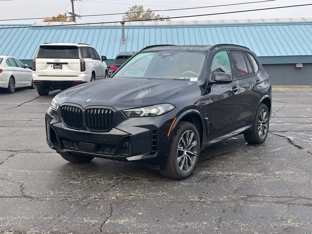 Used 2024 Carbon Black Metallic BMW xDrive50e image 1