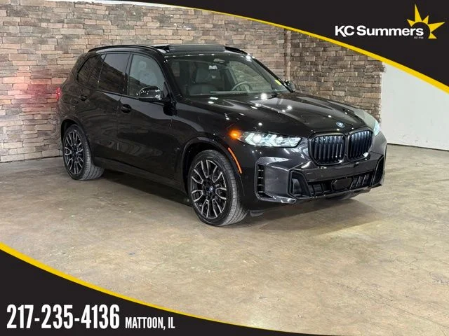 Used 2025 Black Sapphire Metallic BMW xDrive50e image 1
