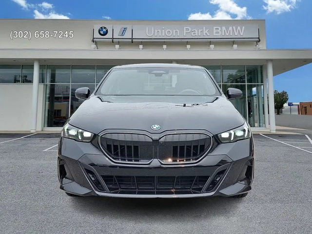 Used 2026 Black Sapphire Metallic BMW 550e xDrive image 2
