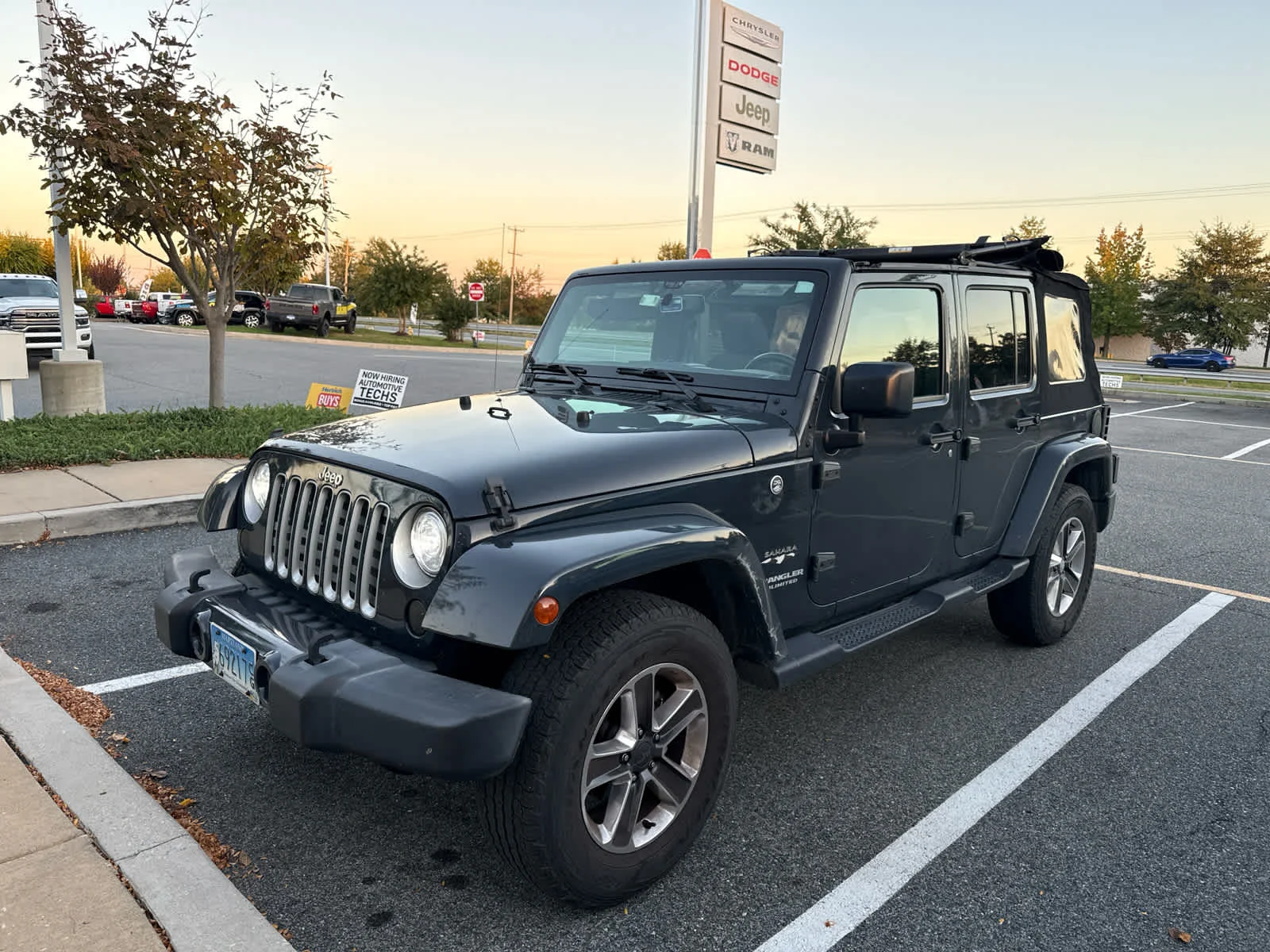 Used 2017 Rhino Clearcoat Jeep Sahara image 1