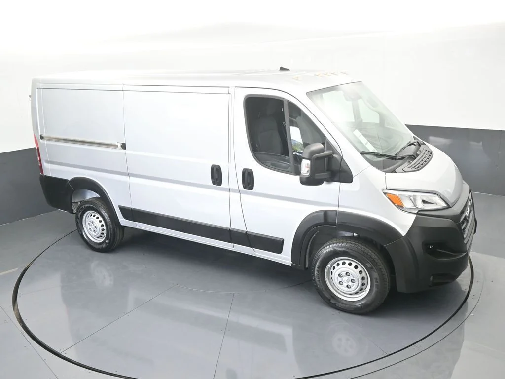 Used 2025 Bright Silver Clearcoat Metallic Ram Low Roof image 44
