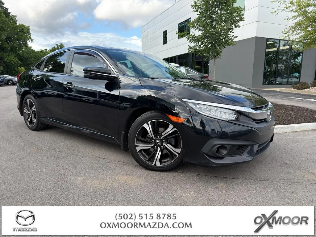 Used 2017 Crystal Black Pearl Honda Touring image 1