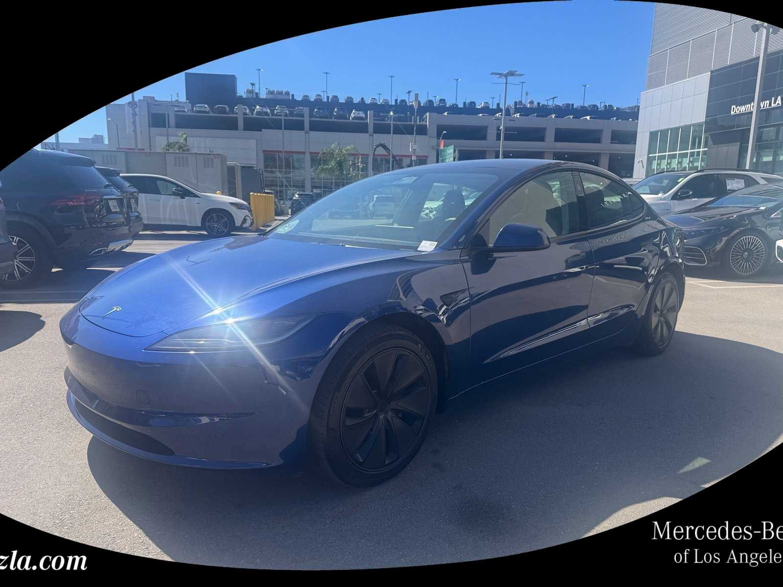 Used 2024 Deep Blue Metallic Tesla  image 1