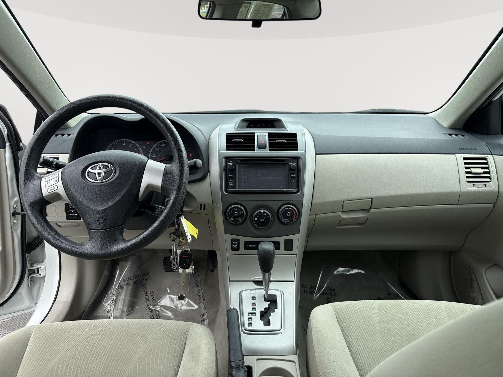 Used 2013 Super White Toyota LE image 23