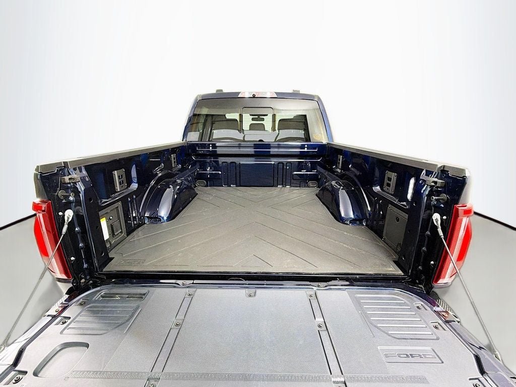 Used 2024 Antimatter Blue Metallic Ford Raptor 4WD SuperCrew 5.5