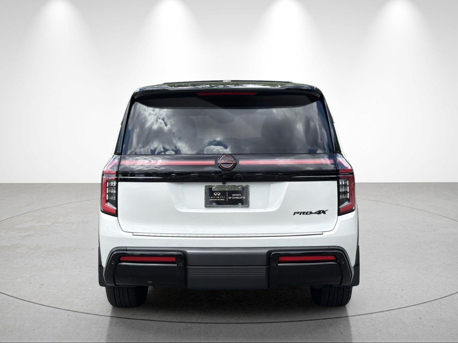 Used 2025 Aspen White Tricoat/Super Black Nissan PRO-4X image 4